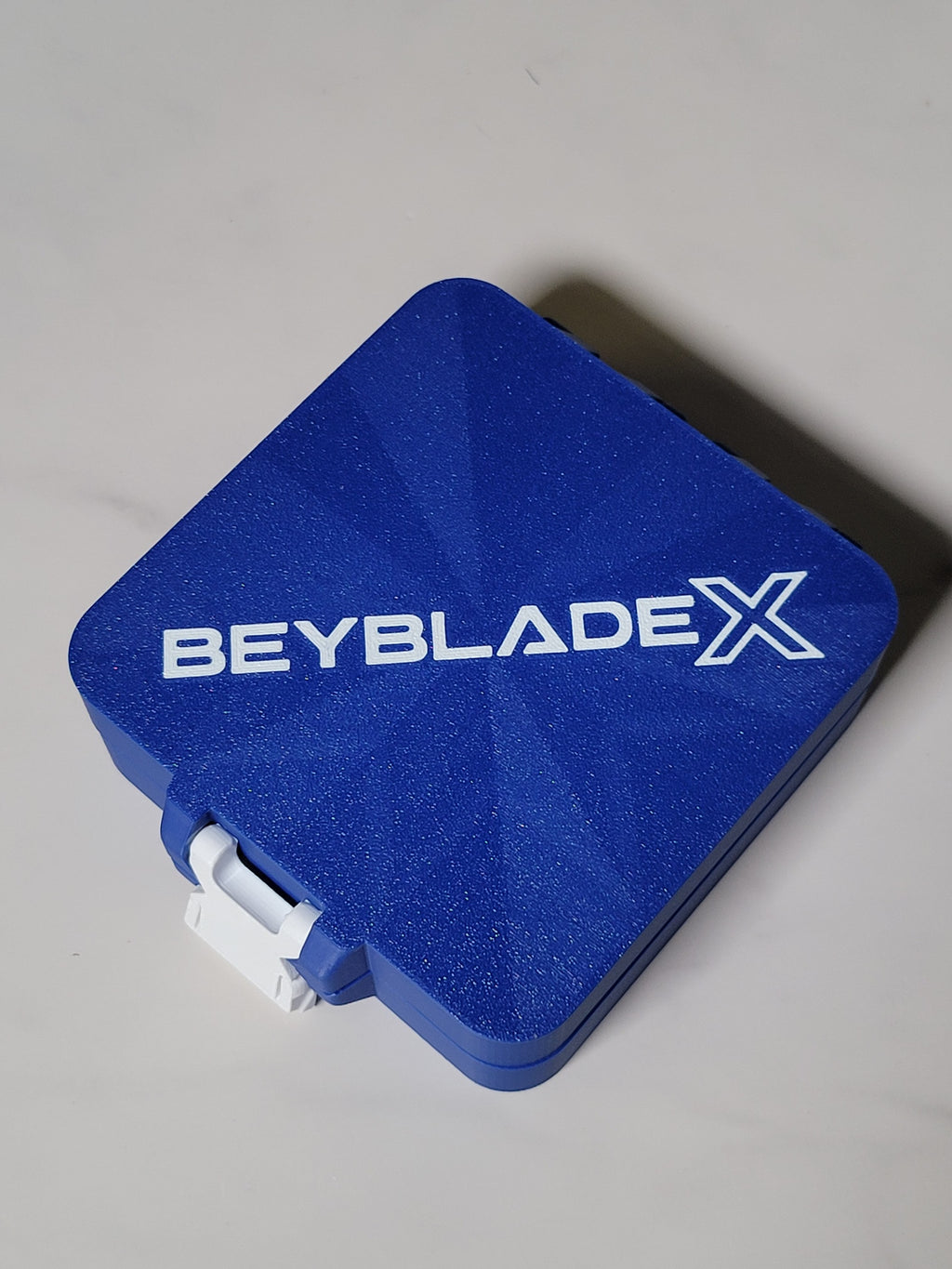 Angled view of the closed blue and white Bit Box.