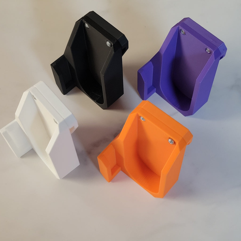 Black, purple, white and orange Ruzz3D launcher holsters arranged together.