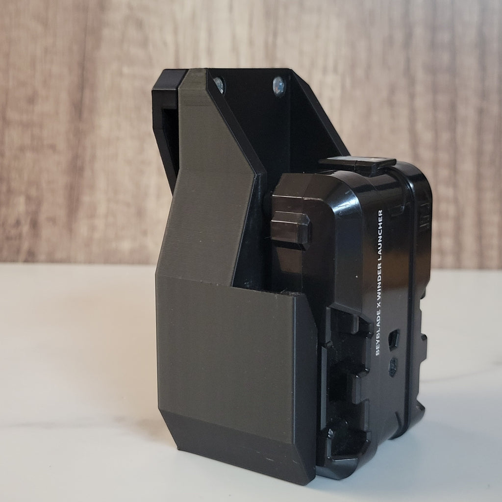 Black launcher fitted into a black Ruzz3D holster.