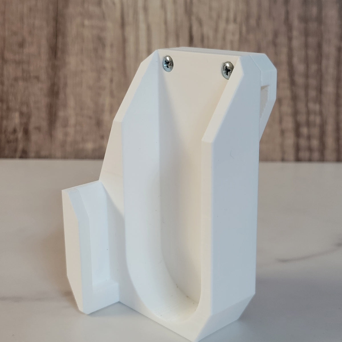 White launcher holster showing the mounting side.