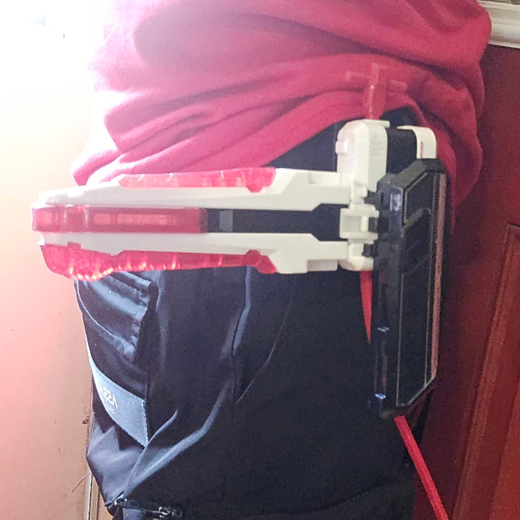Launcher holster worn on a belt with a side attachment kept in place.