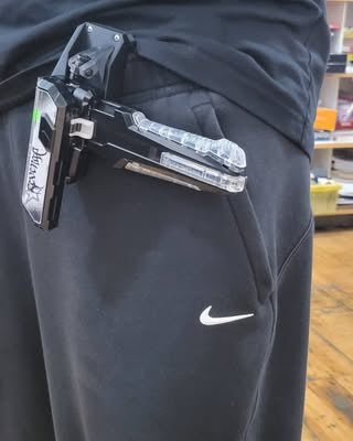 Beyblade launcher and Ruzz3D accessory carried on the side of a waistband.