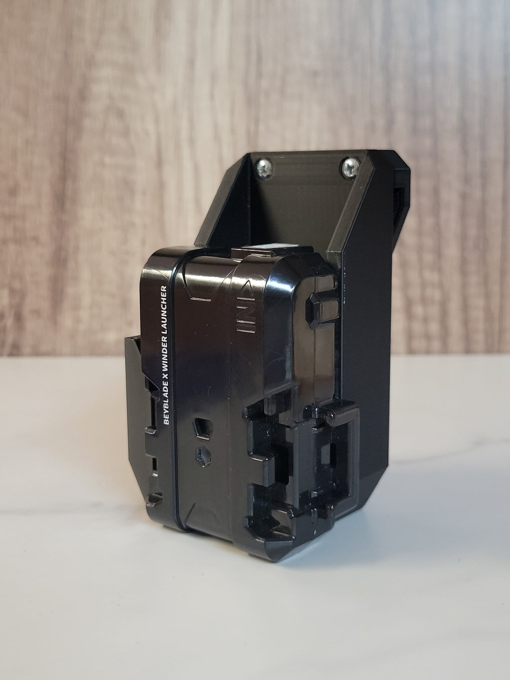 White launcher holster with a black launcher attached