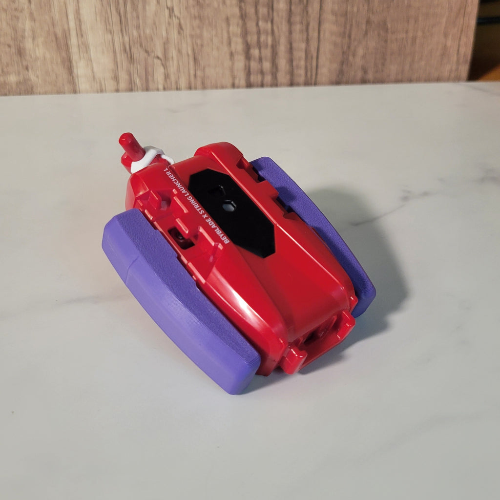Angled side view of the purple string launcher grip.