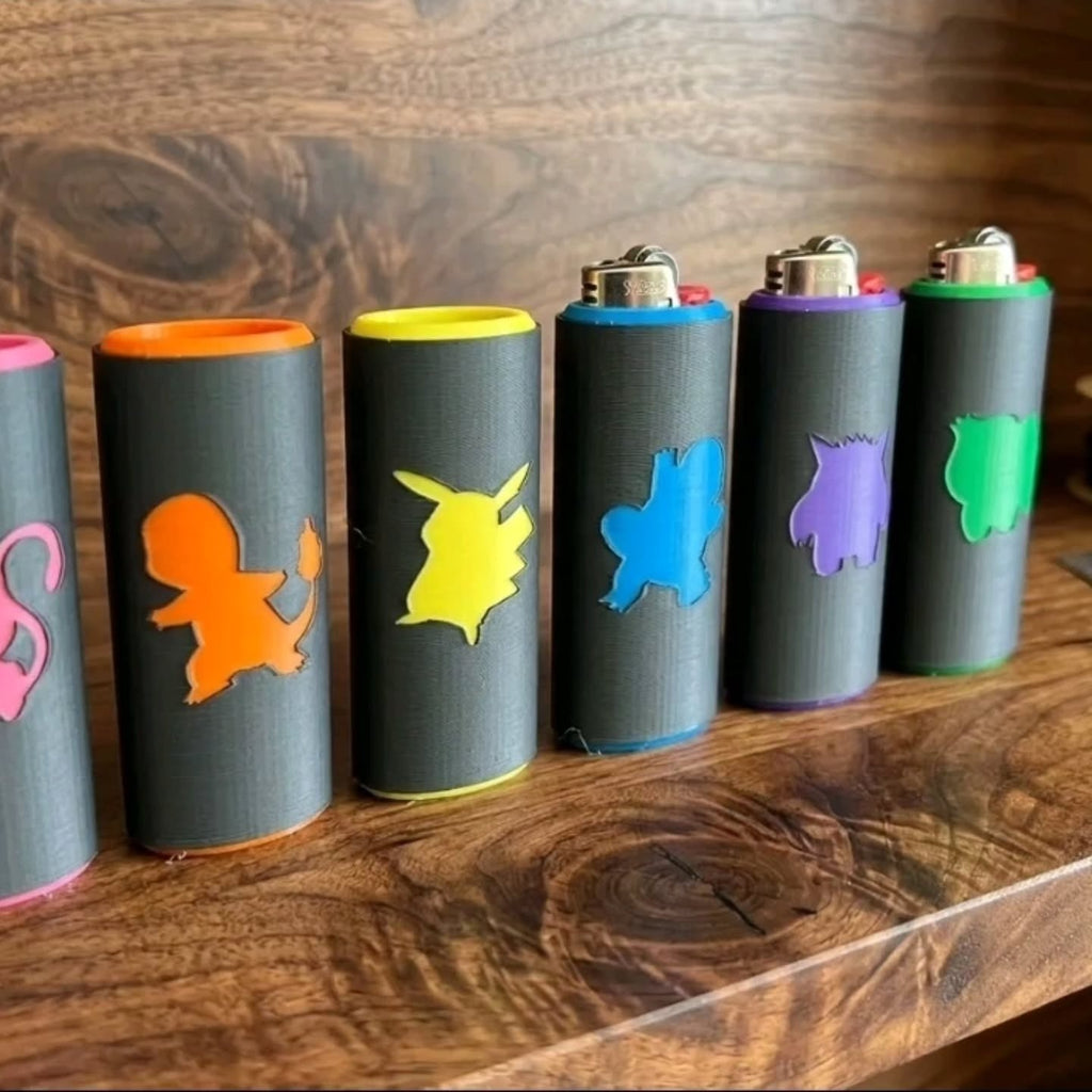 A row of custom lighter covers with colored character silhouettes.