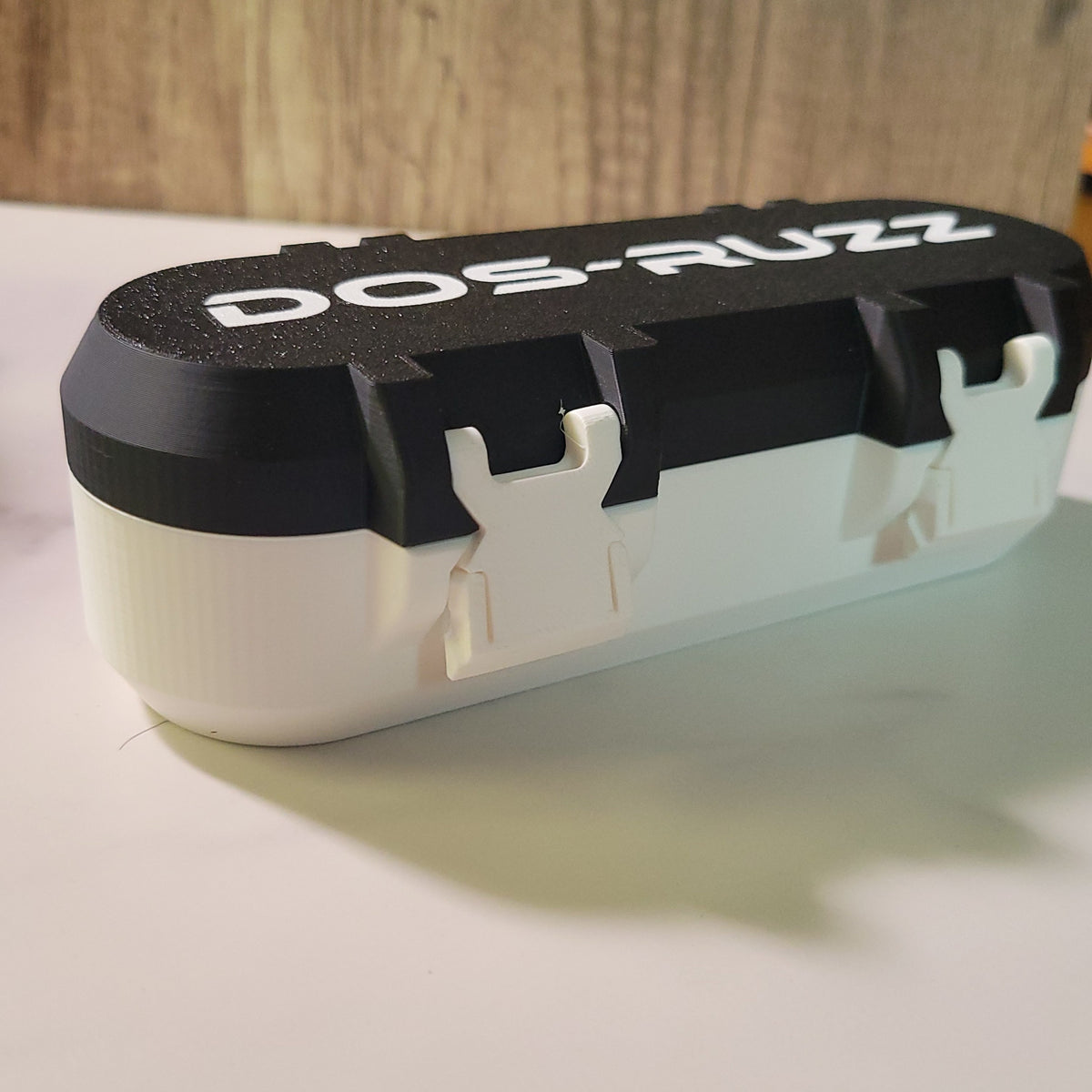 Side view of a black and white custom Beyblade X deck box.