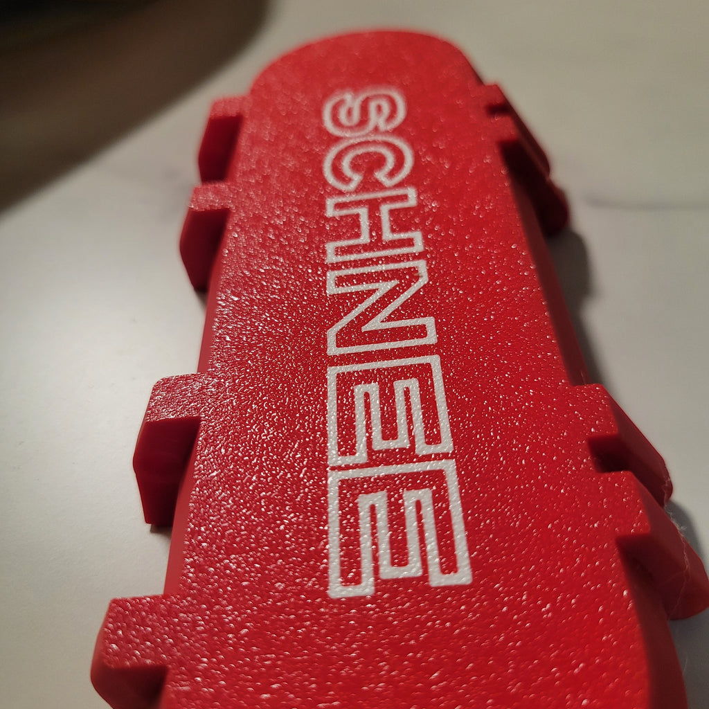 Red custom deck box with personalized textured lettering.