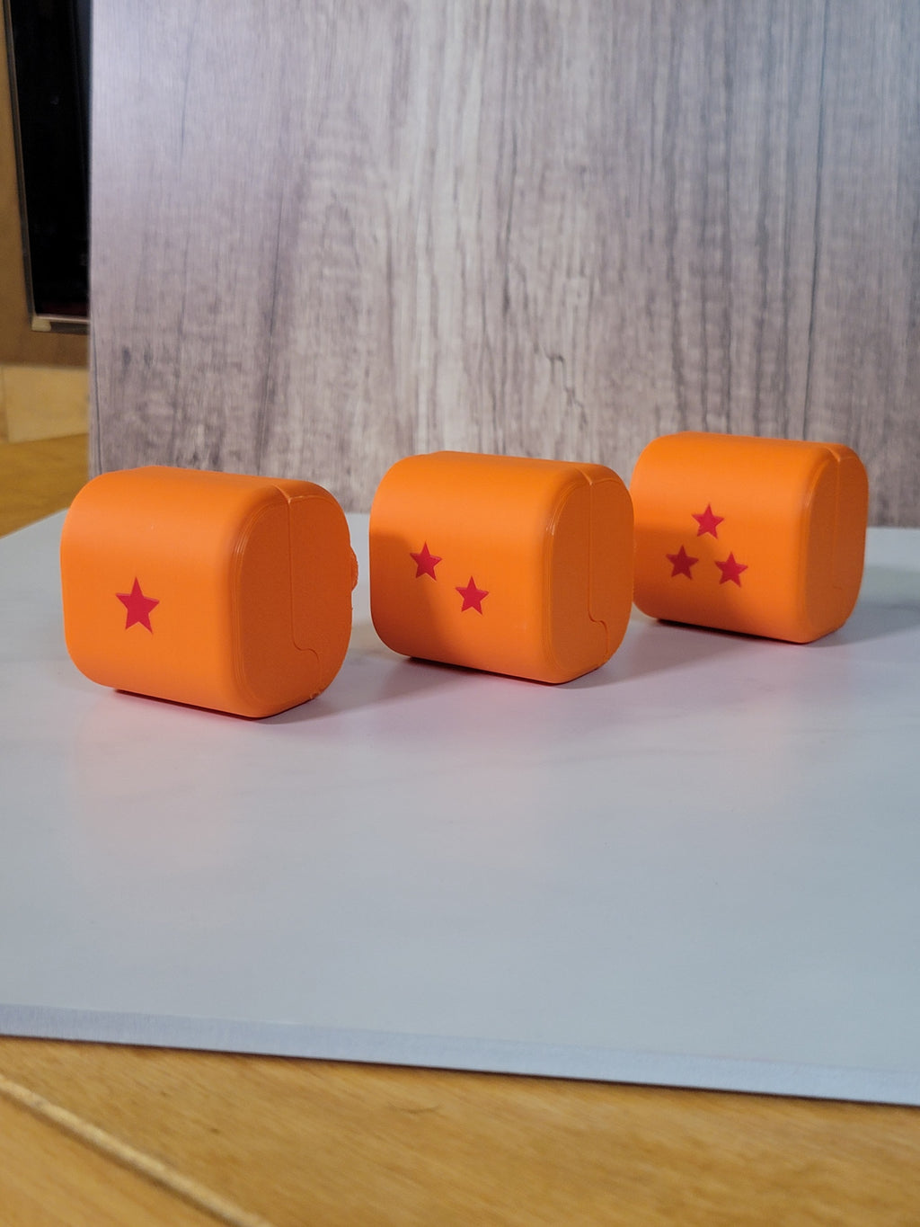 Orange Dragon Ball-inspired belt deck boxes shown as actual prints.