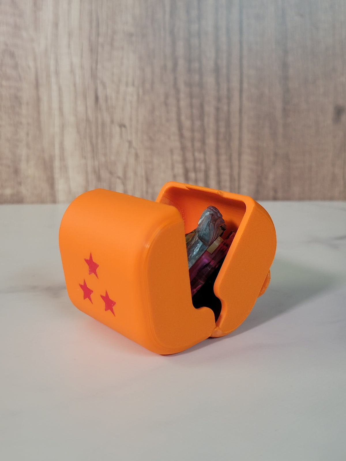 Orange printed belt deck box shown from another angle.