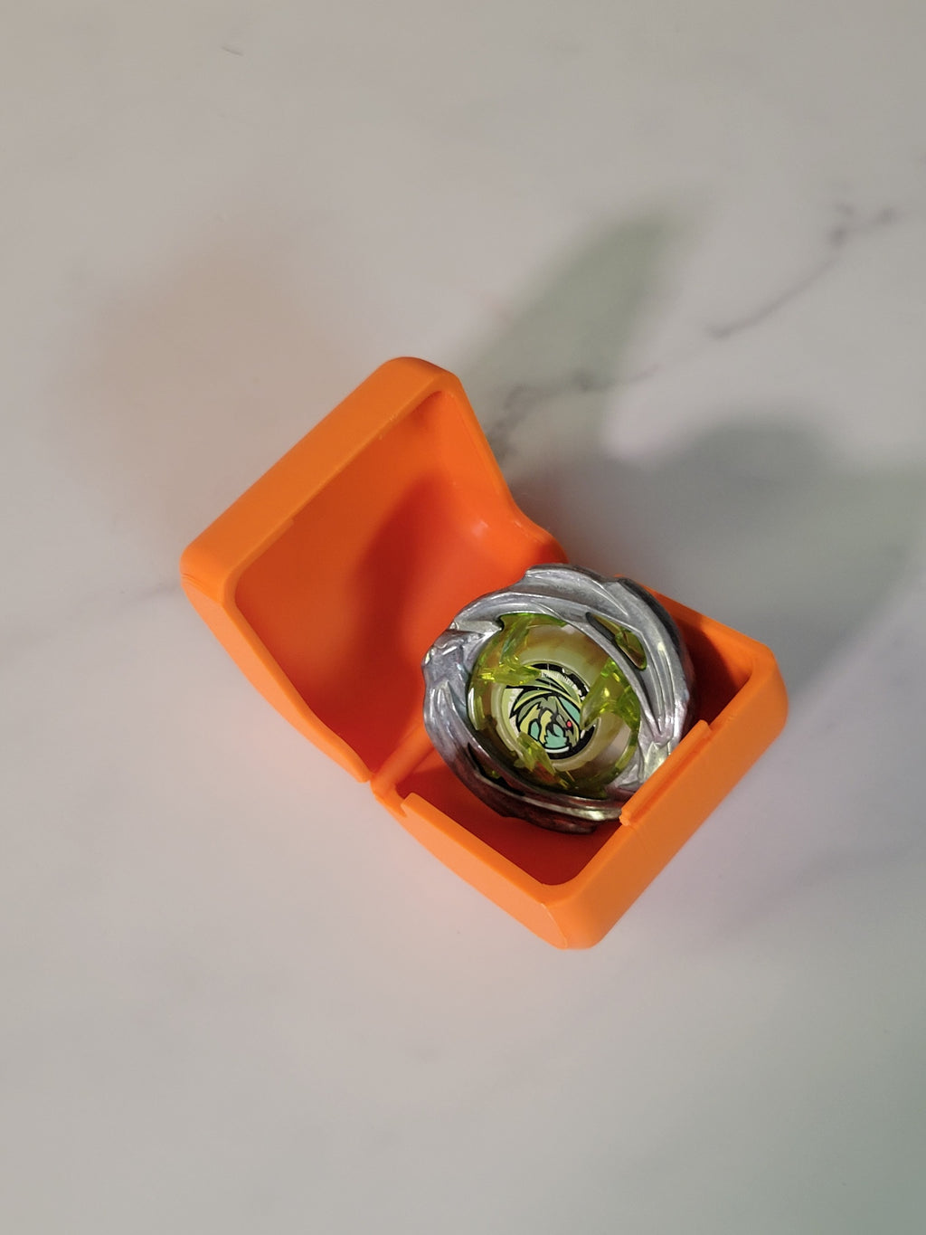 Close-up of an orange deck box and its attachment area.