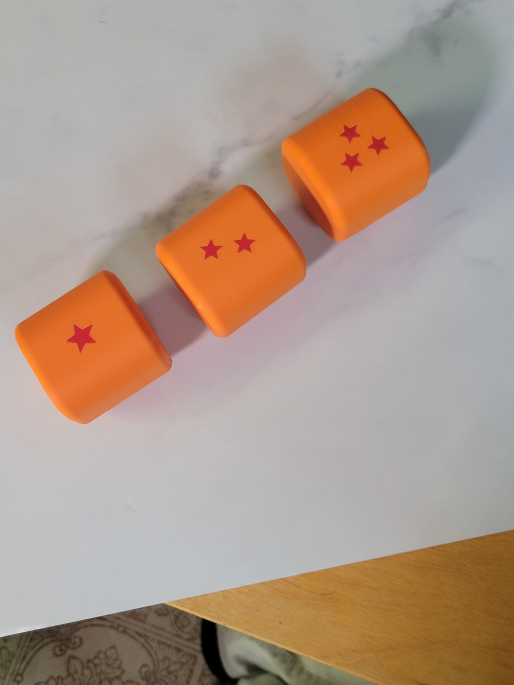 Open orange deck boxes showing their interiors and star details.