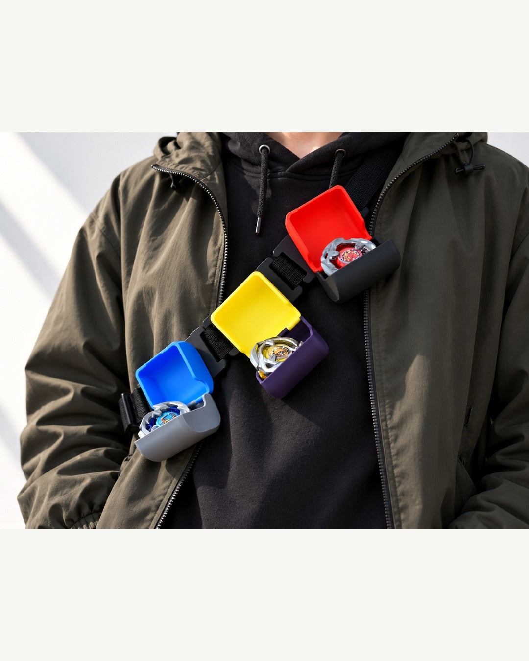 Worn display concept showing colorful deck boxes attached to clothing.