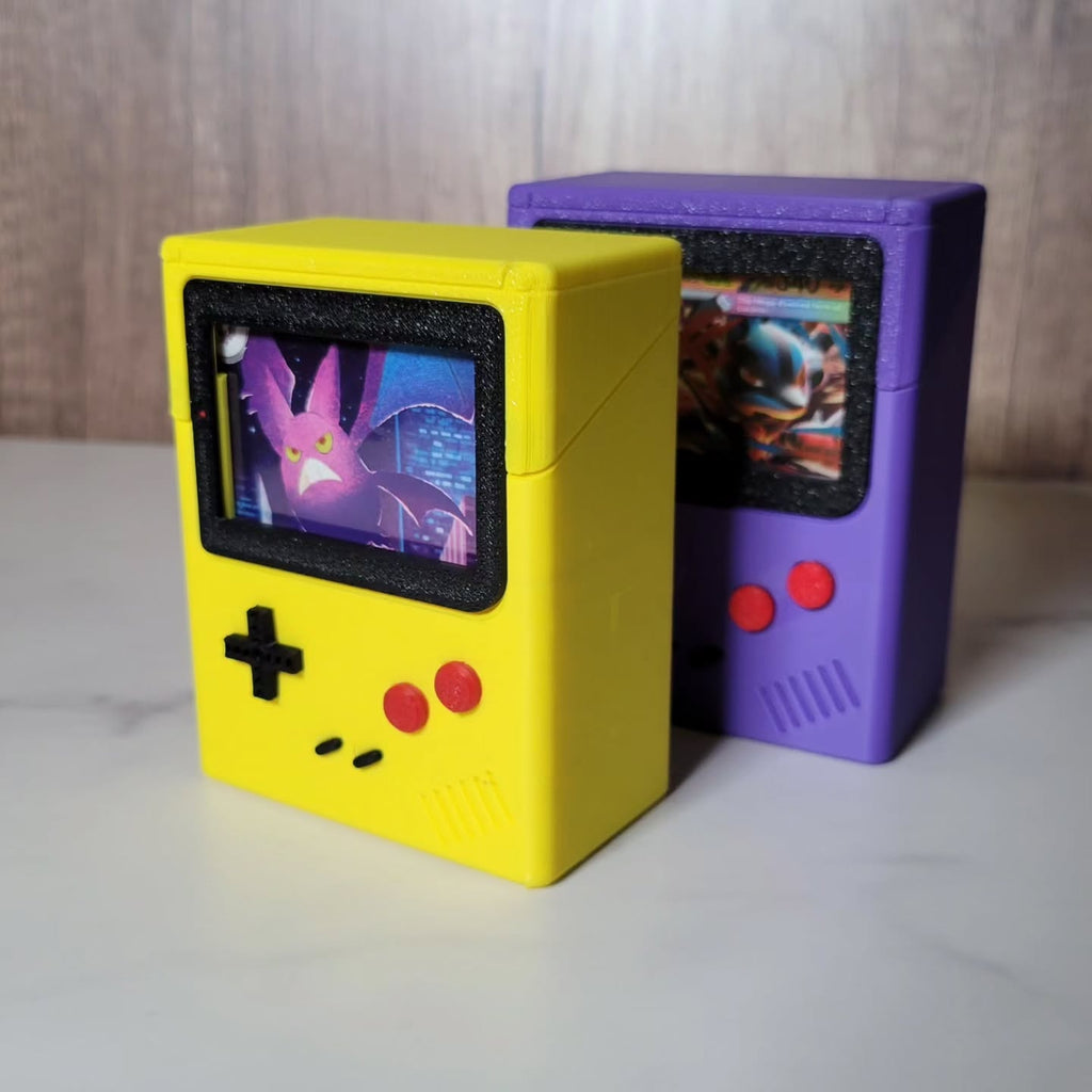 Yellow and purple Game Boy Color-inspired TCG deck boxes with front card display windows by Ruzz3D.