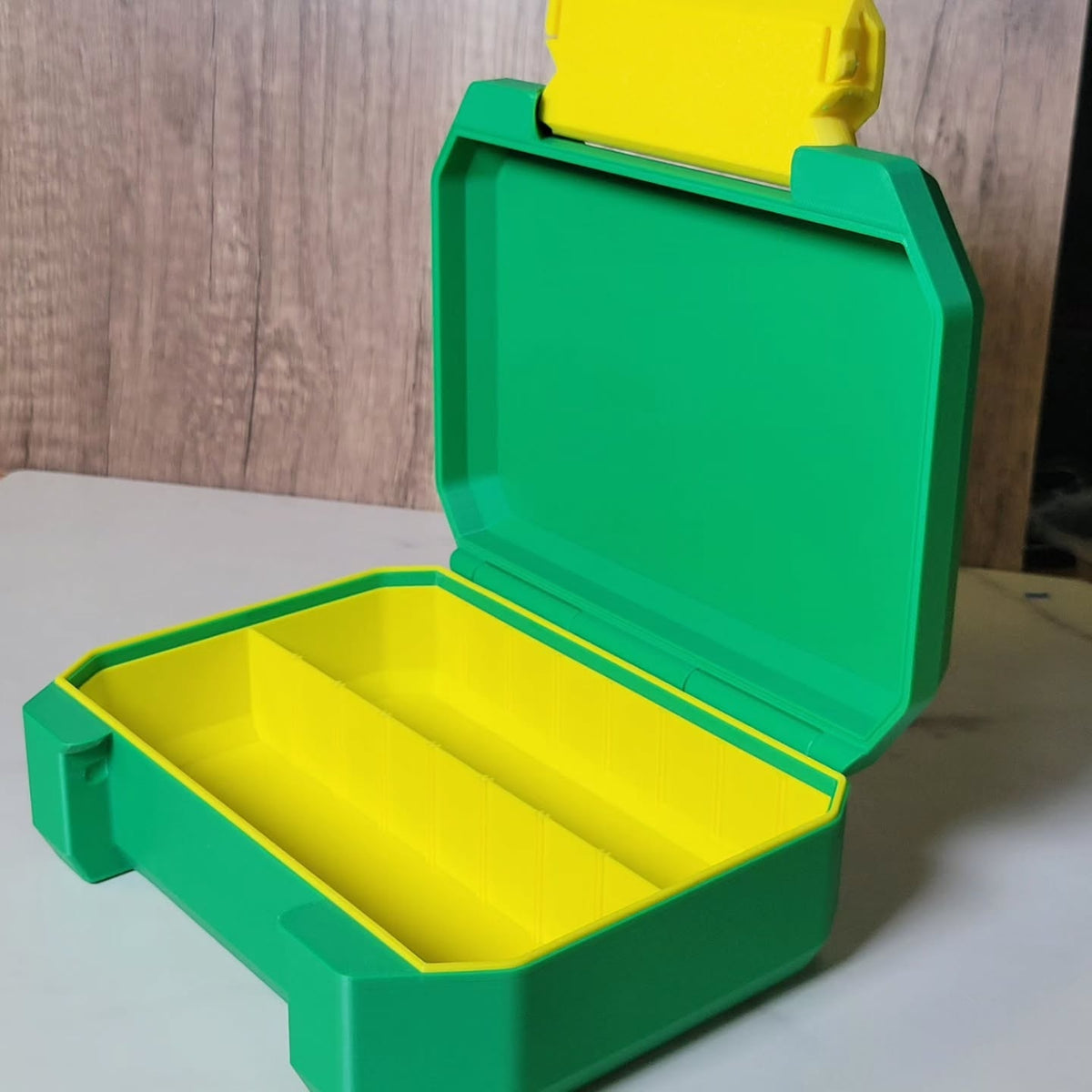 Open Ratchet Box showing yellow removable dividers.