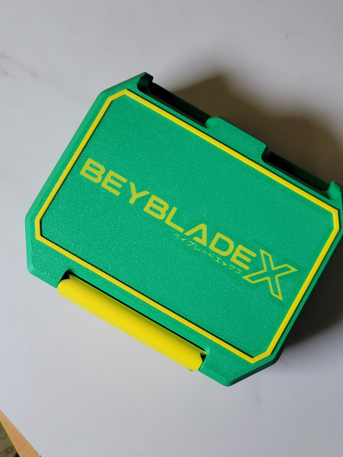 Green and yellow Ratchet Box with Beyblade X lid design