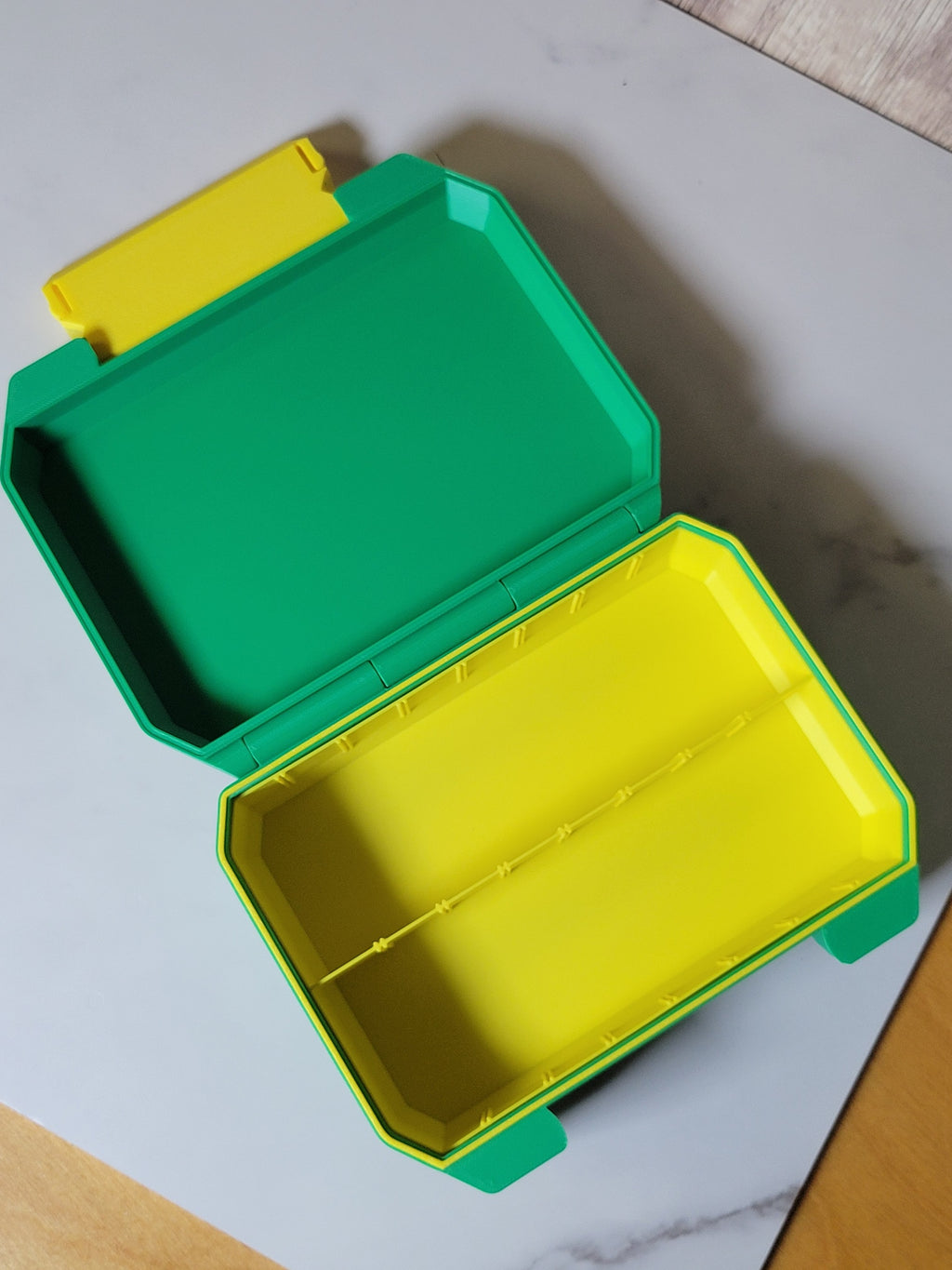 Open Ratchet Box showing the empty divided interior
